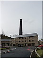 New housing on the site of Blackpits Mill, with the chimney in the background