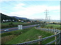 Farm access road heads west towards Cadfor