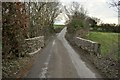 Heading south across a bridge over the river Caen between Little Stowford and West Stowford Barton