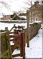 Fingerpost and kissing gate in West Gilling