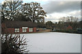 Bowling green under light snow