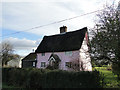 Candy pink thatched cottage in Dunwich Lane, Heveningham