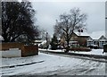 Junction of a snowy Evelegh Road and  Farlington Avenue