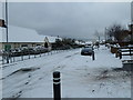 Junction of a snowy   Solent Road and Highlands Road