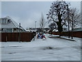 Looking up a snowy South Road from the crossroads with Central Road