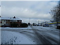 Junction of a snowy   Fitzherbert  Road with Waterworks Road