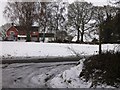 Buildings at Rookery Farm seen from a footpath