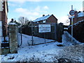 A snowy entrance to East Lodge Playing Field