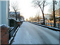 Newport : Cardiff Road snowy side road, clear main road