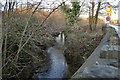 The view downstream on Bradiford Water from the bridge which carries the northbound carriageway of the A361 at Pottington