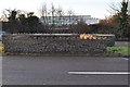 Looking west across both carriageways of the A361 where Bradiford Water passes underneath