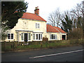 Cottage with sundial on Wangford Road (B1126)