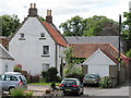 Houses beyond the market cross in Coldingham