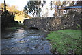 A bridge over Colam Stream at Muddiford as seen from downstream