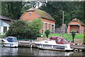 Boats moored by a pumping station