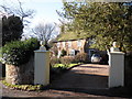 House and gateposts, at Beggearn Huish