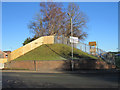 Bridge wall and disused railway embankment