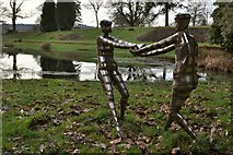 SS6140 : Bob Walters' stainless steel people frolicking by the pond at Arlington Court by Roger A Smith