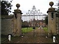 Ornate gates and gate piers to Clifford Chambers Manor