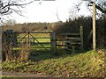 TL7343 : A stile and public footpath as seen from the A1092 by Robert Edwards