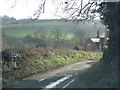 Road drops towards Spring Cottage