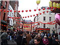 TQ2980 : Chinese New Year Decorations on Gerrard Street by Robert Lamb