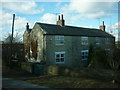 A farm on the A64 at the top of Kiddal Lane