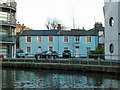 Blue cottages by the canal