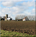 Cottages and All Saints church, Sharrington