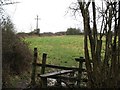 Stile and field at the end of the main track through Clanger Wood