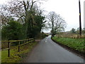 Approaching a sign to the green in Stoke Charity