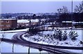 Snow over Broadfield - roundabout next to Broadfield Barton shopping parade