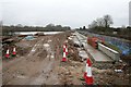 Flood alleviation works continue on a sleety day