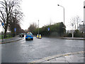 TQ4277 : Mini-roundabout on Charlton Park Lane by Stephen Craven