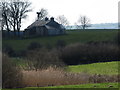 Farmhouse with wind pump above Islandmoyle Lough