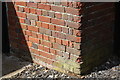 Benchmark on outbuilding at Cross Farm