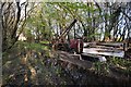 Abandoned vehicle beside groundwater in Sampson