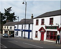 J2458 : Bank and shops on the corner of Ballynahinch and Lisburn Streets by Eric Jones
