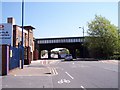 Narrow arched railway bridge over Boundary Street