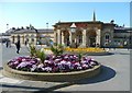 NZ6621 : Floral roundabout and station building, Saltburn-by-the-Sea by Humphrey Bolton