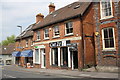 Shops on Mill Street including Cut21 (hairdressers) and mintbookkeeping