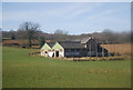 Graffitied farm building