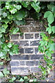 Benchmark on the wall of Lansdowne Walk