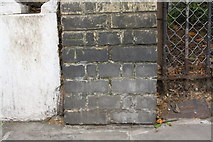 TQ2480 : Benchmark on wall pier of Kensington Park Road by Roger Templeman