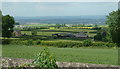 Overlooking farm and fields by Church Lane