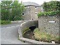 Brook dives under the road