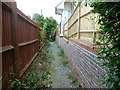 TQ0519 : Footpath alongside new housing estate by Dave Spicer