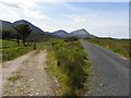 B9326 : Lane and Road at Tullaghobegly by Kenneth  Allen