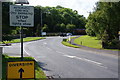 Cars waiting patiently for the cement train to pass