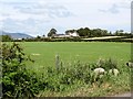 View across farmland to Springfield Villa